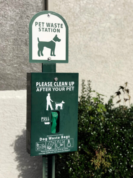 green pet waste station closeup